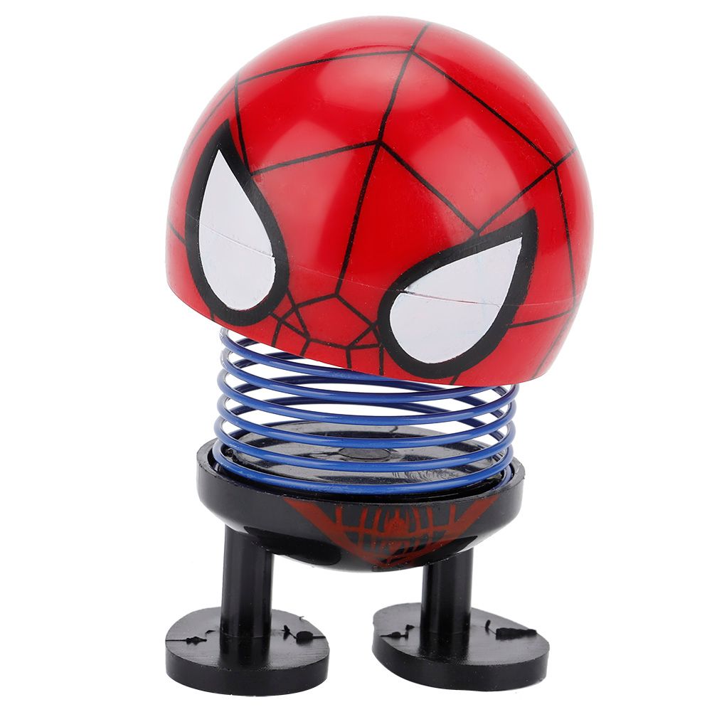 Shaking head toy ornament featuring a cartoon doll head with wobble motion, designed for ride-on car decoration by Everything Baby.