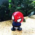 Cartoon doll head wobble toy ornament with shaking head, suitable for ride-on car decoration, by Everything Baby.