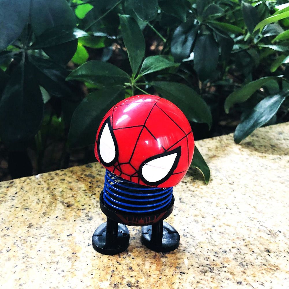 Cartoon doll head wobble toy ornament with shaking head, suitable for ride-on car decoration, by Everything Baby.