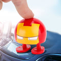 Two cartoon wobble head dolls with shaking heads, suitable as car ornaments, from Everything Baby, designed for ride-on cars.