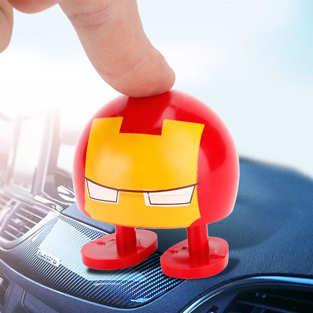 Two cartoon wobble head dolls with shaking heads, suitable as car ornaments, from Everything Baby, designed for ride-on cars.