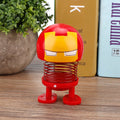 Two cartoon wobble head doll ornaments resembling robot car decorations, with shaking head movement, suitable for kids' ride-on cars.