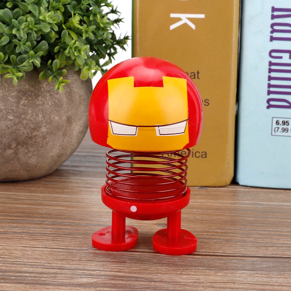 Two cartoon wobble head doll ornaments resembling robot car decorations, with shaking head movement, suitable for kids' ride-on cars.