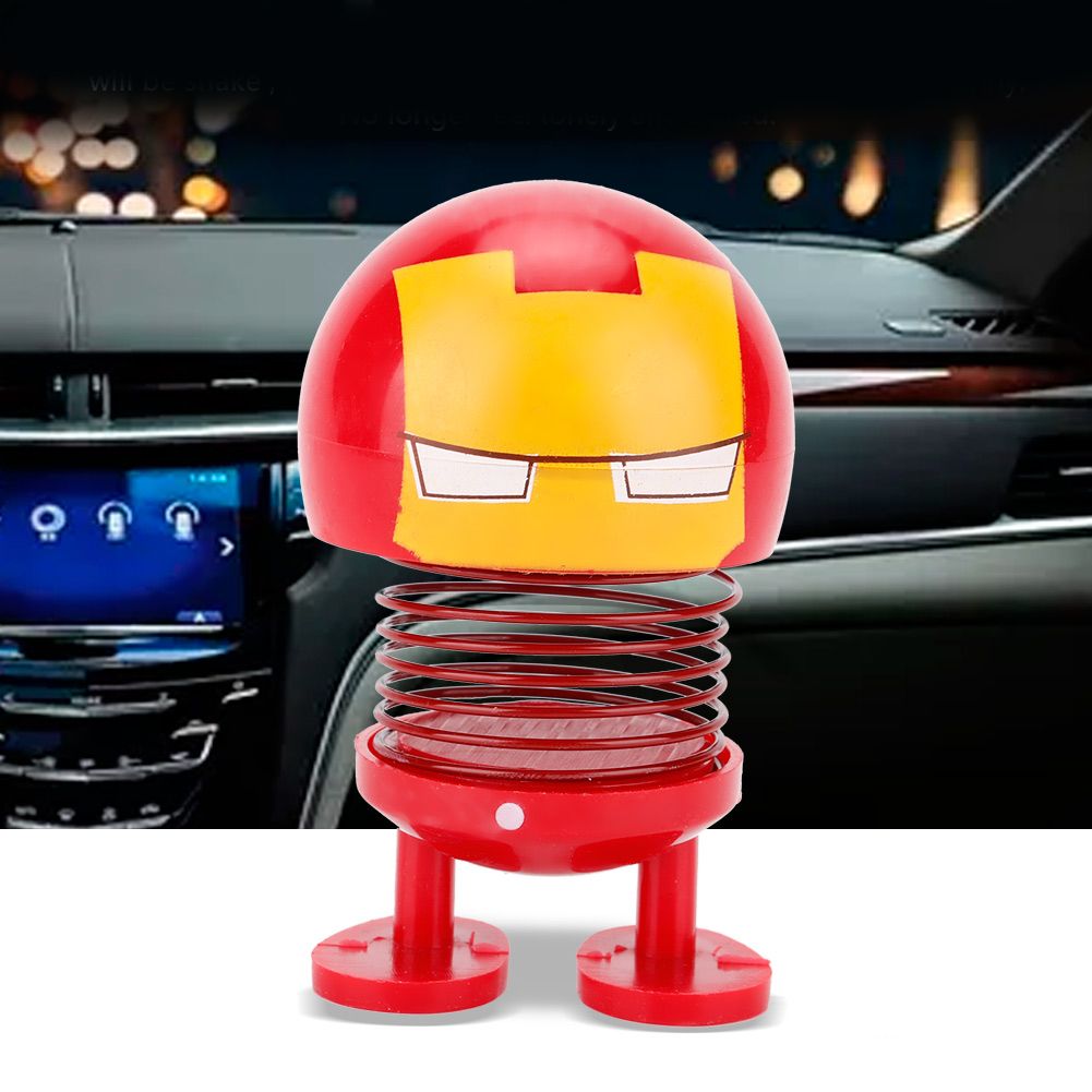Cartoon doll head wobble toy for kids ride-on cars, featuring a playful robot design with shaking head ornament.