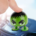 Cartoon wobble head doll ornament featuring a shaking head, designed for ride-on cars and car decorations by Everything Baby.