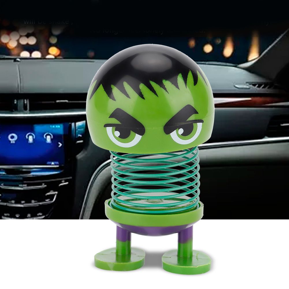 Cartoon doll head wobble toy ornament for kids' ride-on cars, featuring a playful robot design for car decoration.