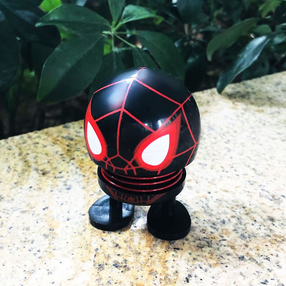 Baby & Kids wobble head cartoon doll ornament with shaking head design, suitable for ride-on cars and car decoration.