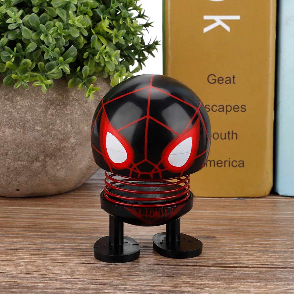 Baby toy with a cartoon doll head and wobble effect, designed as a robot car ornament for kids' ride-on cars by Everything Baby.