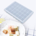 Blue 28-grid silicone ice tray and pudding mold with lid, ideal for baby feeding, baking, and chocolate freezing.