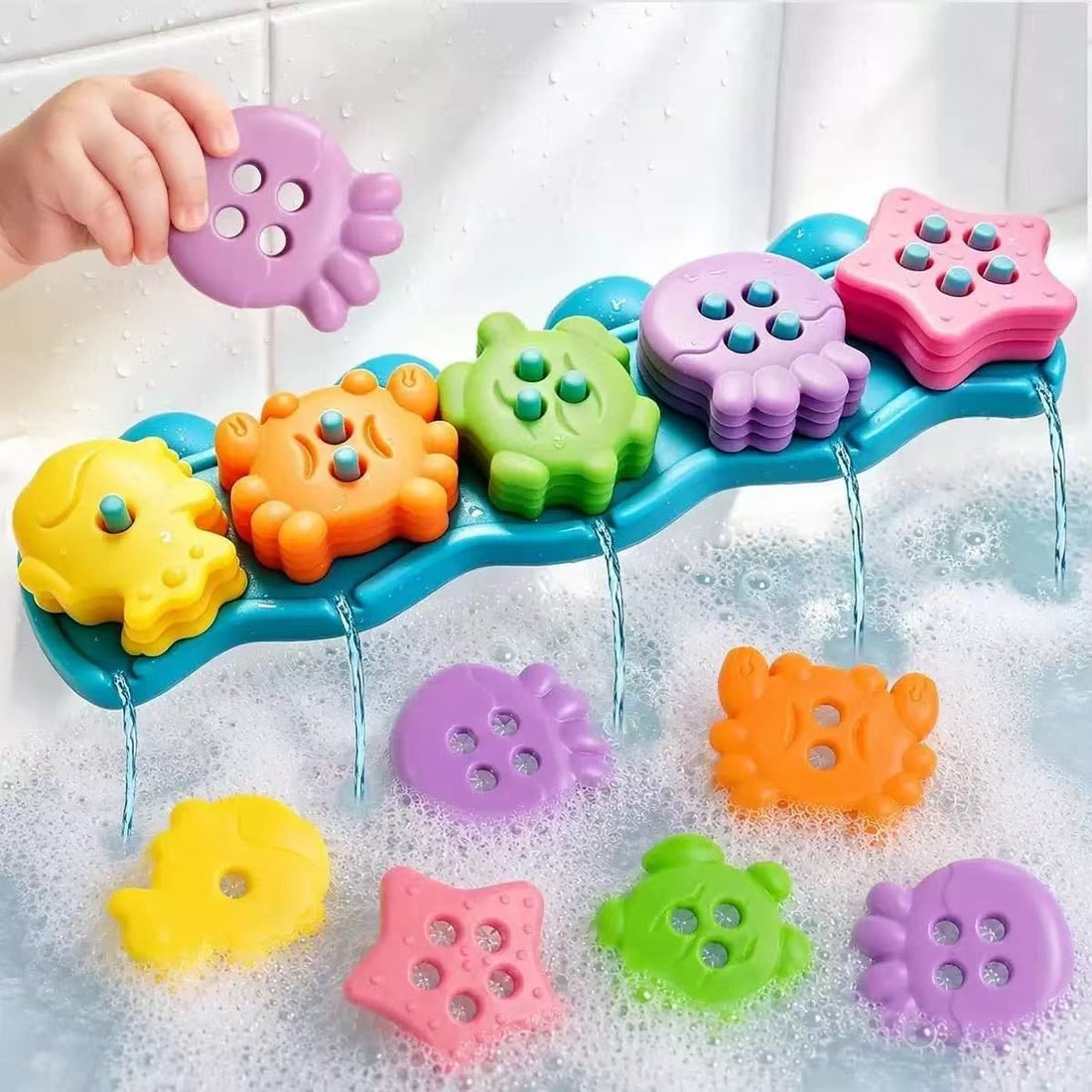 Colorful silicone stacking bath toy set with sea creatures and suction cup wave base for kids' water play and adventures.