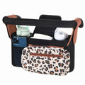 Black and white checkered multifunctional stroller organizer bag with insulated bottle holder and adjustable straps, hanging or crossbody style.