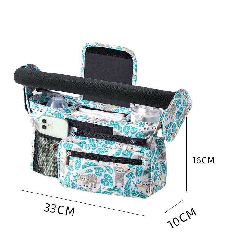 Green Sloth multifunctional stroller organizer bag with insulated bottle holder, detachable pouch, and adjustable straps for on-the-go use.