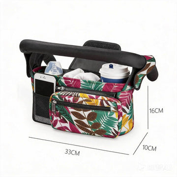 Tropical leaf design multifunctional stroller organizer bag with insulated bottle holder, detachable pouch, and adjustable straps.