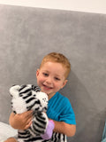 Soft plush interactive tiger toy for babies by Everything Baby, featuring feeding and sleeping simulation functions.