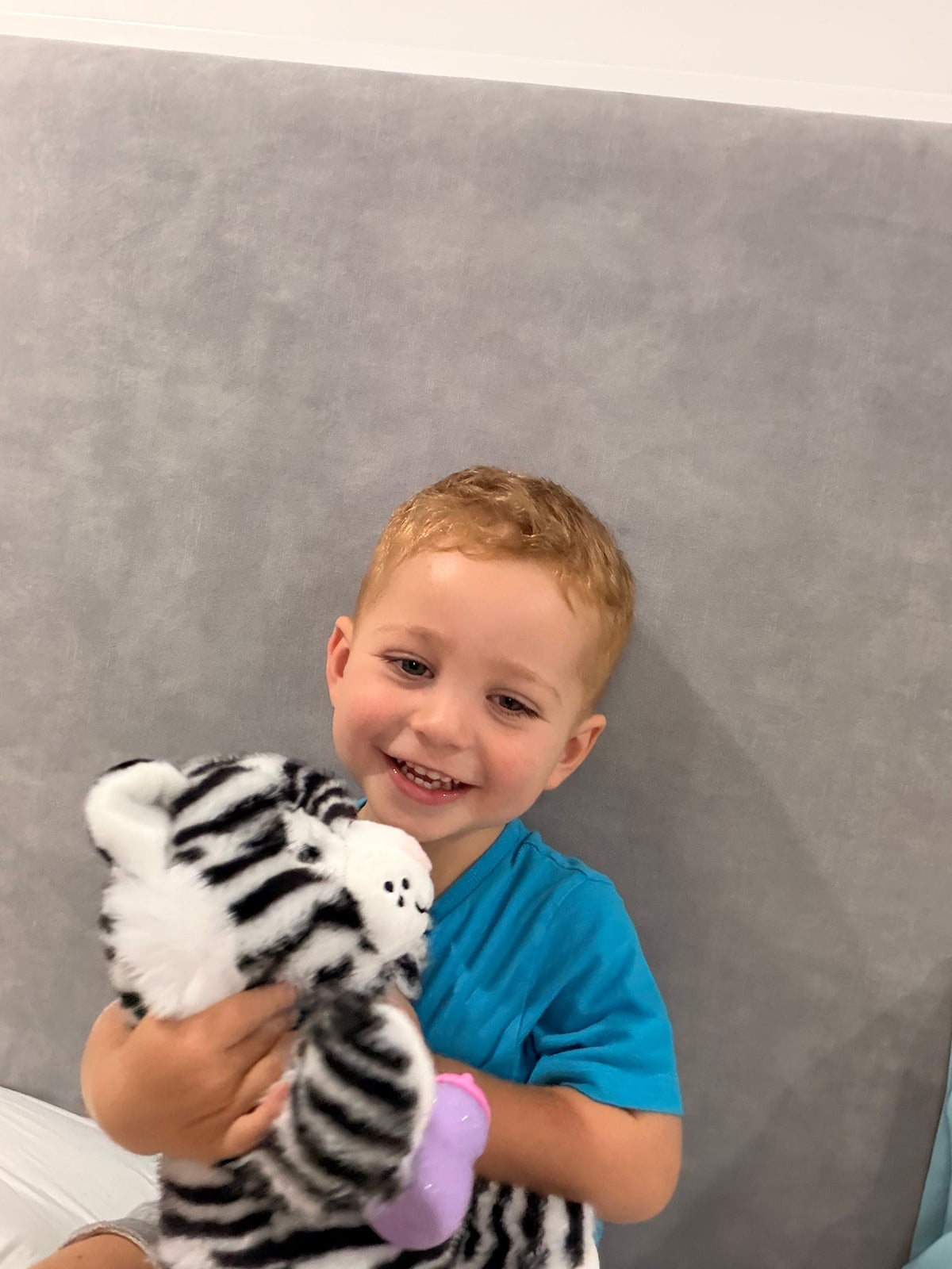Soft plush interactive tiger toy for babies by Everything Baby, featuring feeding and sleeping simulation functions.