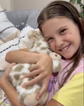 Soft plush interactive giraffe toy for babies, featuring feeding and sleeping simulation, from Everything Baby.