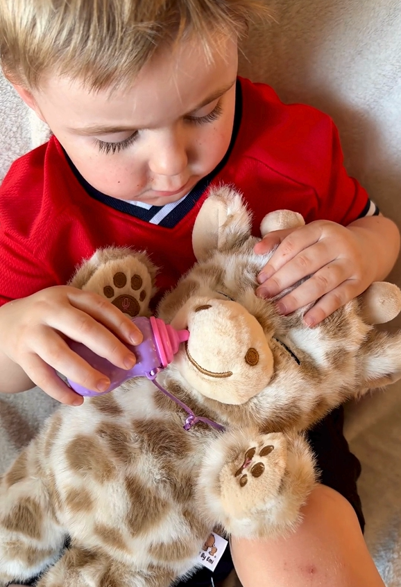 Soft plush interactive giraffe toy from Everything Baby, with feeding and sleeping simulation features for babies and kids.