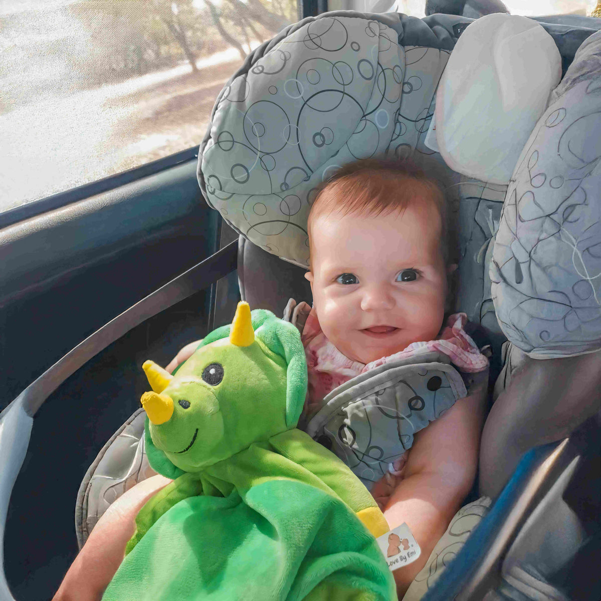 Cute plush Dash the Dinosaur musical toy for babies and kids, soft fabric with colorful design from Everything Baby.