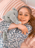 White plush Ellie the Elephant lullaby comforter with musical toy features, designed for soothing babies and kids.
