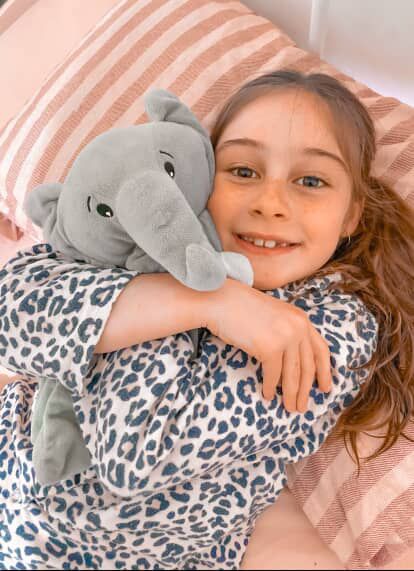 White plush Ellie the Elephant lullaby comforter with musical toy features, designed for soothing babies and kids.