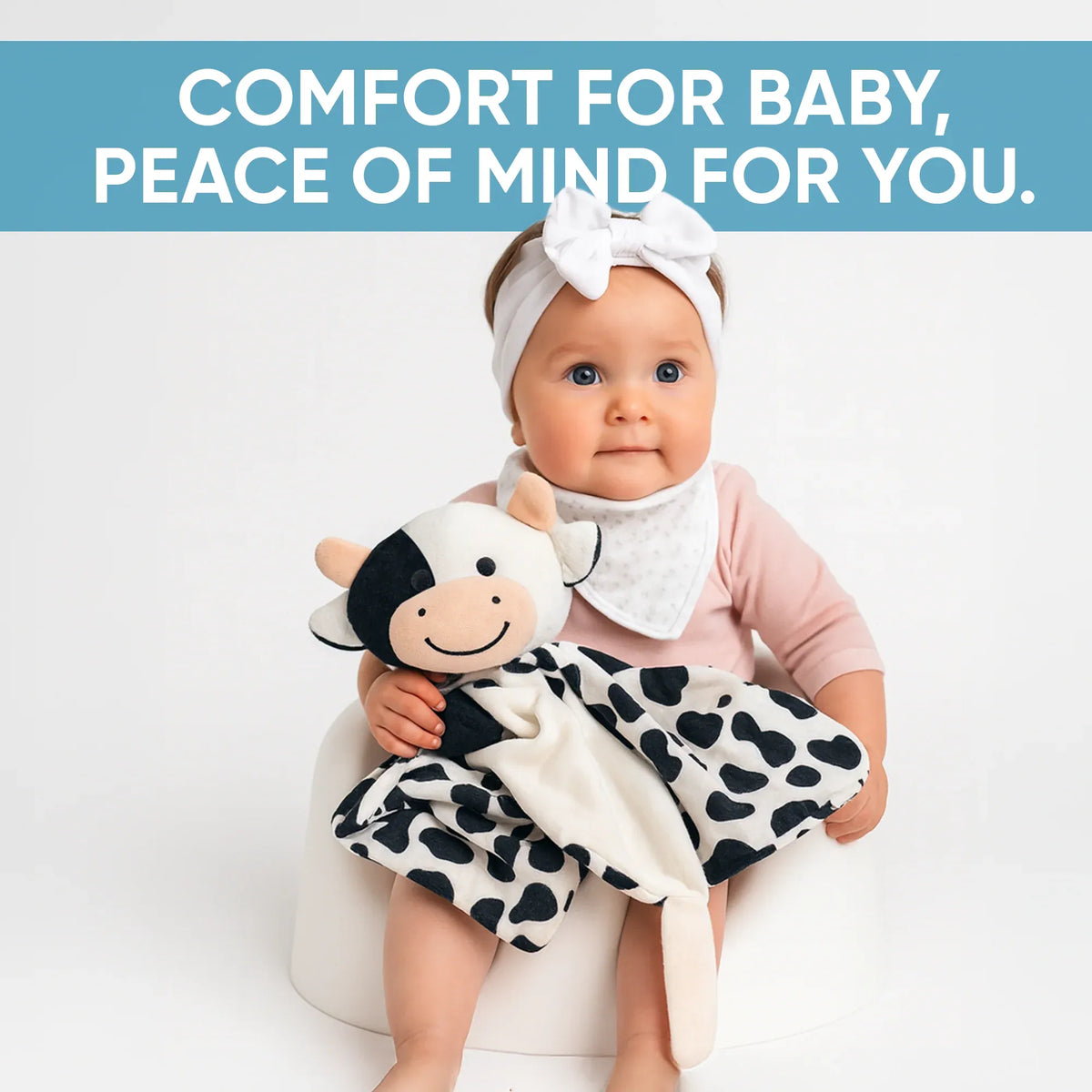 Lylah the Cow baby musical toy and comforter in white, designed for soothing sleep and comfort for infants and young children.