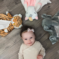 White plush unicorn toy named Maisie with musical features, designed for babies and kids, from Everything Baby.