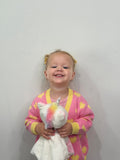 White plush unicorn comforter named Maisie, designed for babies and kids, with musical and lullaby features for soothing relaxation.