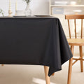 Black waterproof rectangle tablecloth with spillproof and wrinkle-free fabric, suitable for indoor and outdoor dining tables.