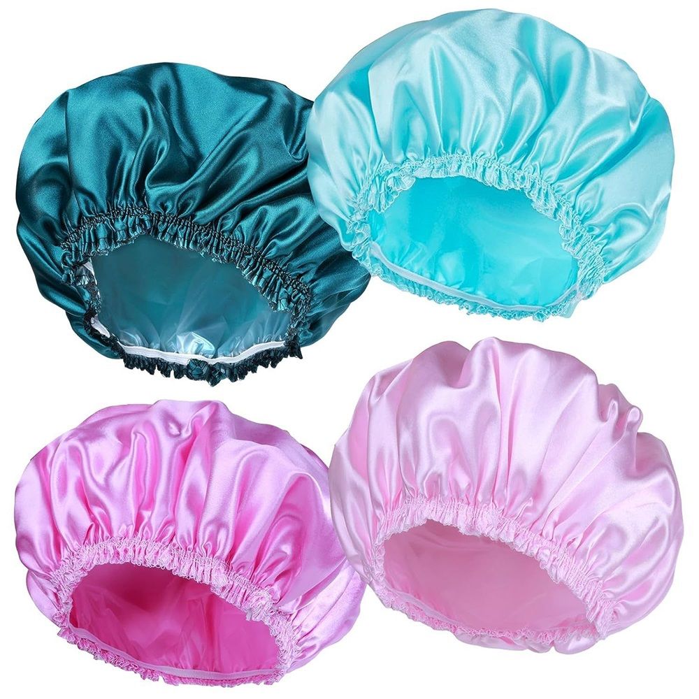 Set of four waterproof women’s shower caps in peacock green, sky blue, pink, and light pink with elastic bands for long hair and braids.