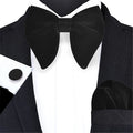 Black velvet oversized bow tie, cufflinks, and pocket square set for boys' tuxedo, styled for formal baby and kids' wear.
