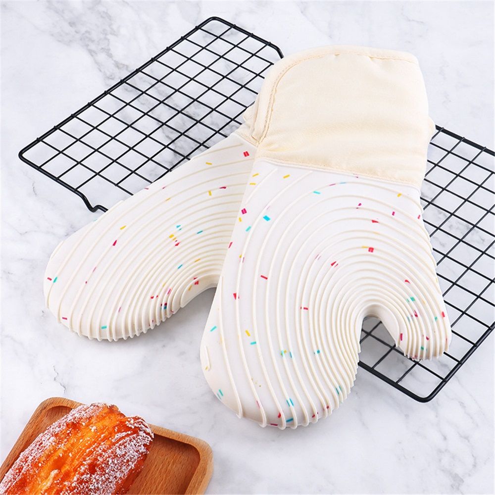 Set of 2 waterproof silicone oven mitts with cotton lining for heat protection, suitable for cooking, baking, and grilling.