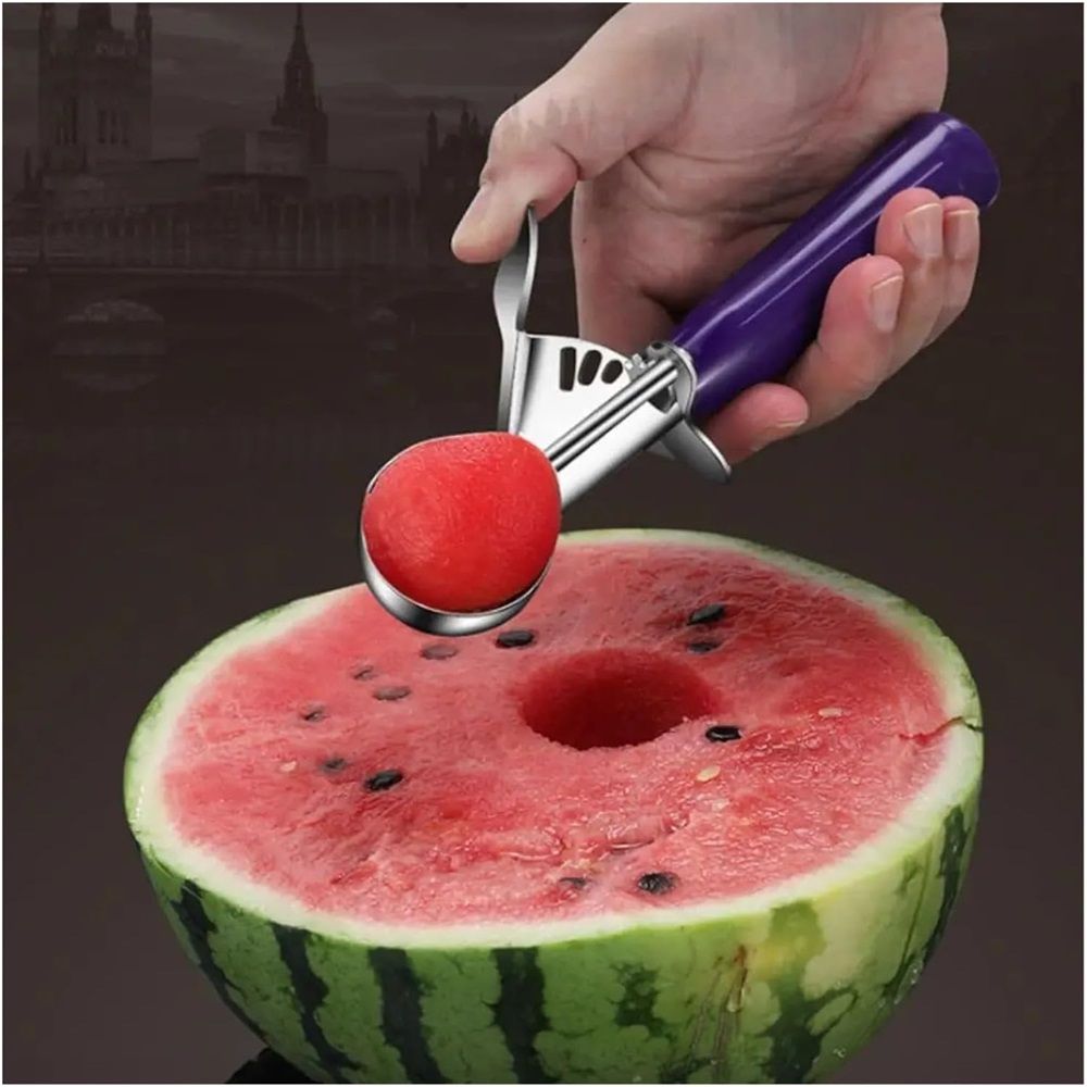 Commercial-grade stainless steel thumb press food disher and ice cream scoop with purple handle, ideal for portioning fruit and food.