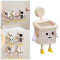 Beige square-shaped kids trash can with arms and legs, featuring a removable trash bag holder, suitable for classrooms and pediatric clinics.