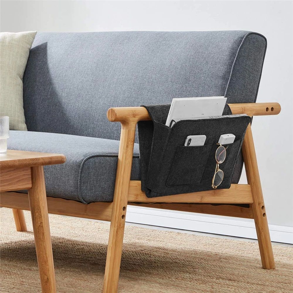 Dark gray bedside organizer for dorm room or bunk bed, storage caddy for remotes, books, tissues, and magazines.