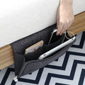Dark gray bedside organizer for dorm room or bunk bed, holds remotes, books, tissues, and magazines, compact storage bag.