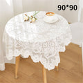 White handmade crochet lace square table runner with embroidered details, perfect for round coffee tables or dresser décor.