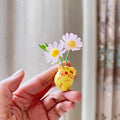 Eight mini ceramic vase fridge magnets with tiny 3D plant designs, perfect for kitchen or office refrigerator decoration.