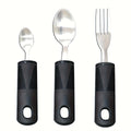 Three-piece stainless steel adaptive baby feeding set with rubber grip handles, including fork and spoon for disabled or rehabilitation use.