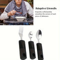 Three-piece stainless steel adaptive baby feeding set with rubber grip handles, including fork and spoon for disabled or rehabilitation use