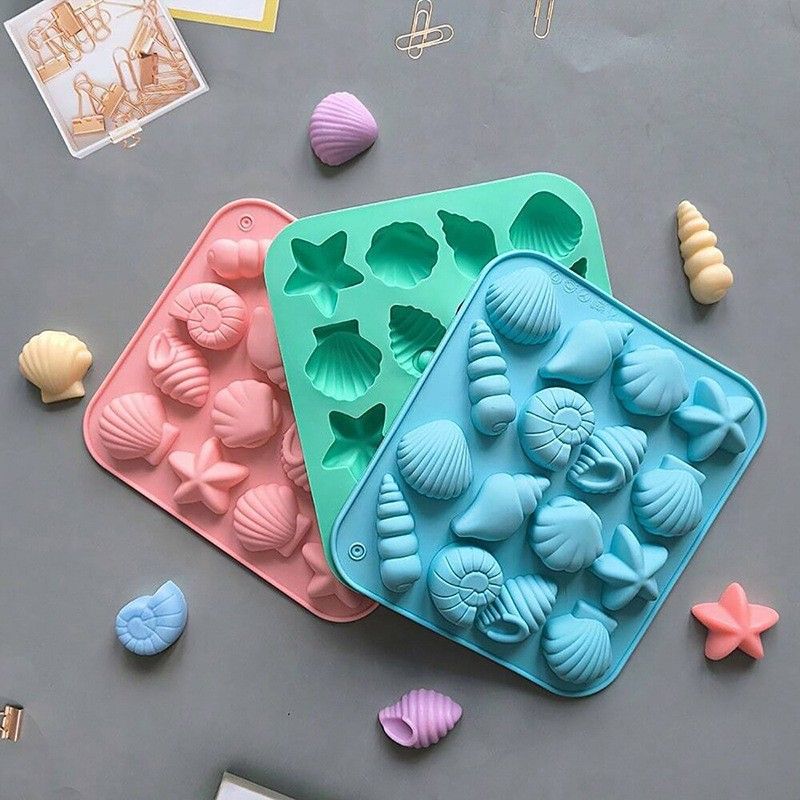 Three ocean-themed seashell silicone molds for chocolate, candy, and fondant cake decorating by Everything Baby.