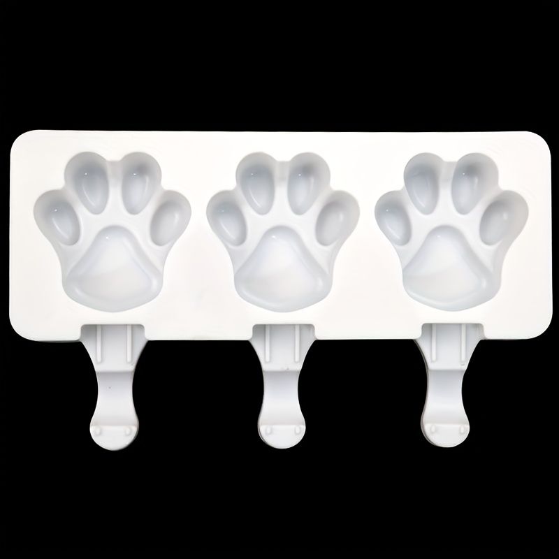 White silicone 2-piece cat paw popsicle mold for kids' pretend play, perfect for DIY summer ice treats, sticks not included.