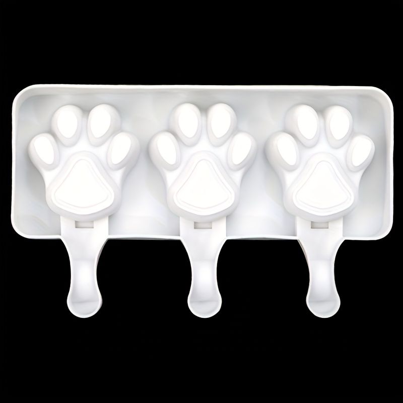 White silicone 2-piece cat paw popsicle mold for DIY summer ice cream treats, with sticks not included, suitable for kids' pretend play.