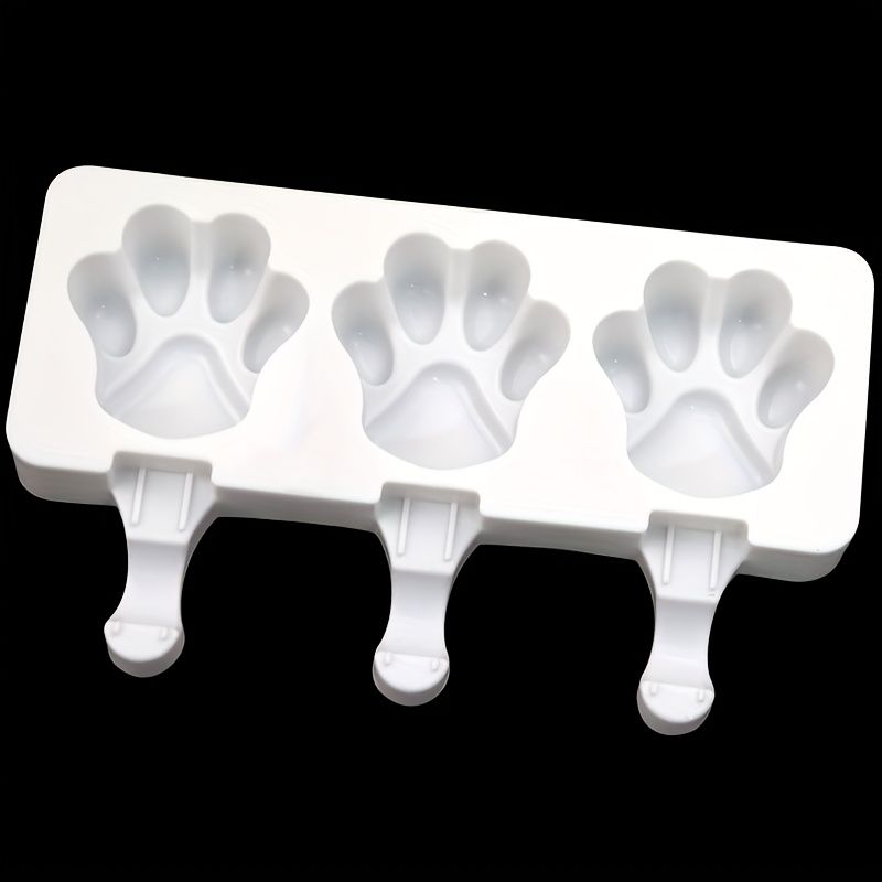 White silicone 2-piece cat paw popsicle mold for kids' pretend play, perfect for DIY summer ice cream treats.