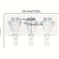 White silicone 2-piece cat paw popsicle mold for kids' summer pretend play, includes sticks not shown in the image.