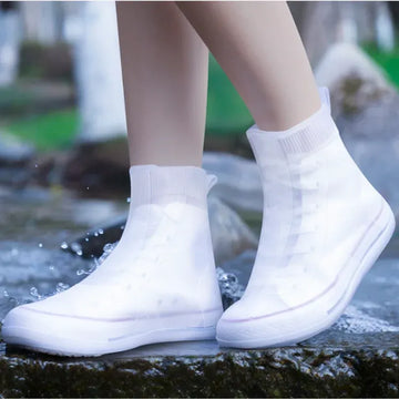 Baby girl's waterproof silicone shoe covers with non-slip grip, reusable outdoor sneaker protectors by Everything Baby.