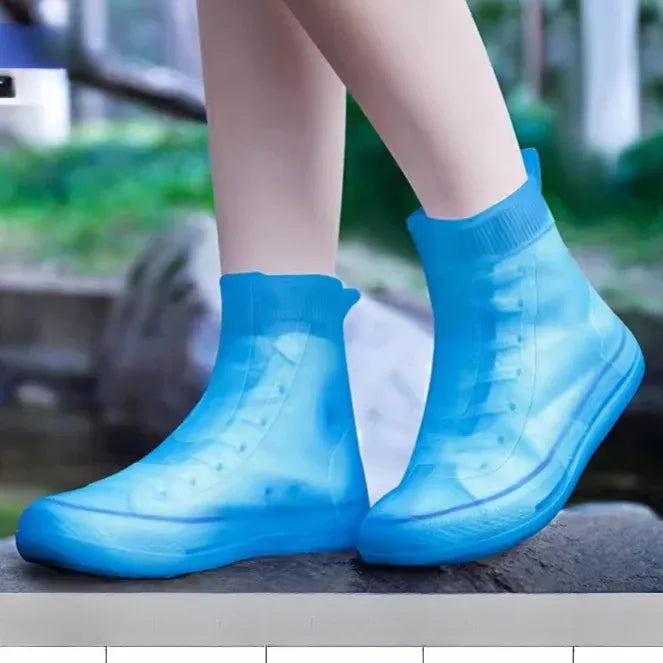 Baby girl's waterproof silicone shoe covers with non-slip grip, reusable outdoor sneaker protectors by Everything Baby.