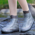 Baby girl waterproof silicone shoe covers with non-slip grip, reusable outdoor sneaker protectors by Everything Baby.