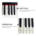 Six piano key sticker set with musical note labels for kids' piano, easy-to-apply stickers for keyboard and piano teaching.