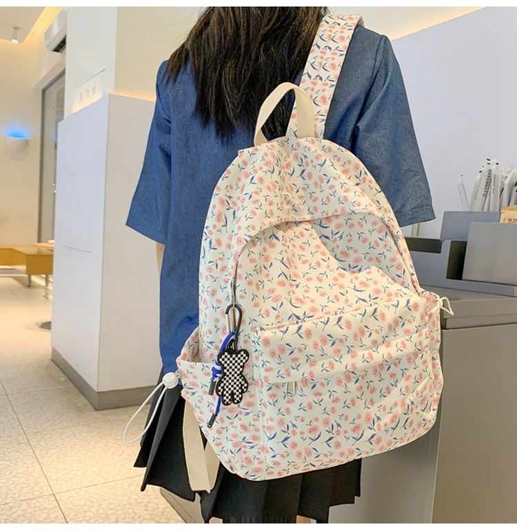 Blue floral backpack for kids with cute spring and summer flower design, casual daypack from Everything Baby.