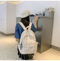 Blue floral aesthetic backpack for kids with cute flower design, perfect for spring and summer casual use